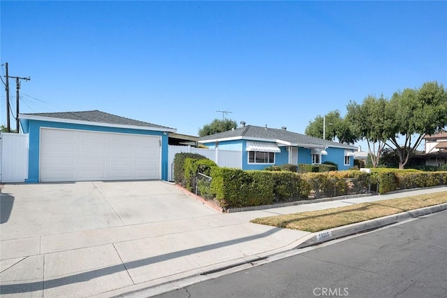 ranch-style home featuring a garage