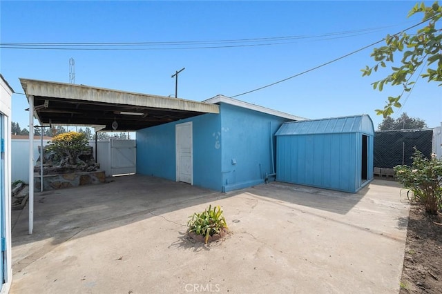 exterior space with a carport