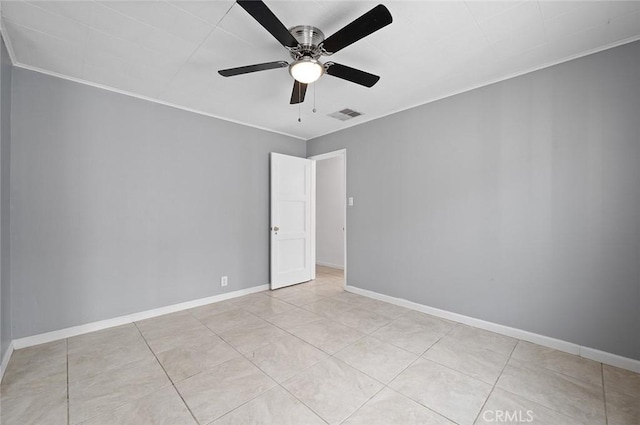 empty room with light tile patterned flooring, ceiling fan, and ornamental molding