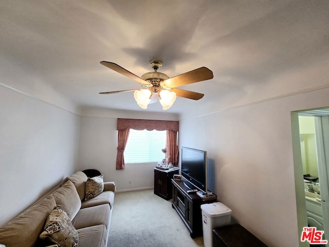 living room with light colored carpet and ceiling fan