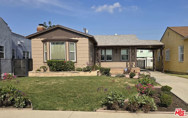 view of front facade featuring a carport and a front lawn