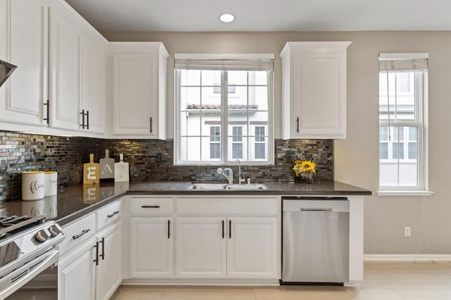 kitchen featuring white cabinetry, sink, and stainless steel appliances