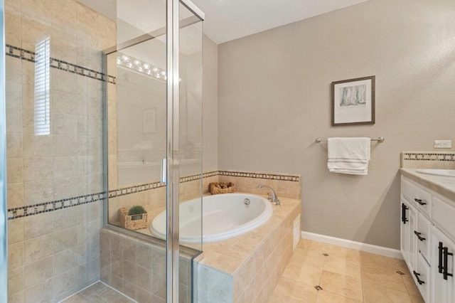 bathroom featuring vanity, tile patterned flooring, and separate shower and tub