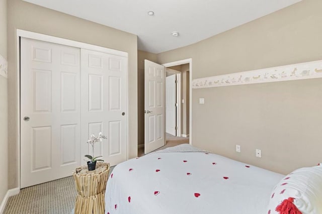 carpeted bedroom with a closet