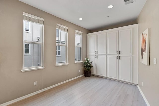 unfurnished bedroom with light hardwood / wood-style flooring