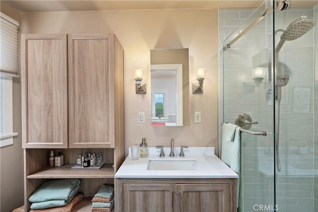 full bathroom with vanity and a shower stall