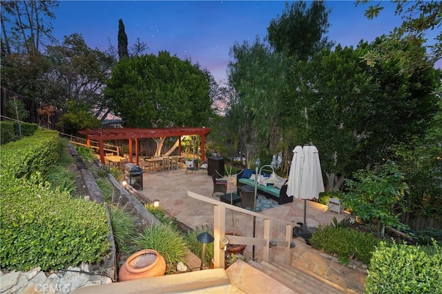 patio terrace at dusk with fence, an outdoor hangout area, and a pergola