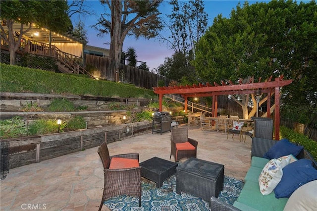 patio terrace at dusk featuring a grill, a fenced backyard, an outdoor living space, and a pergola