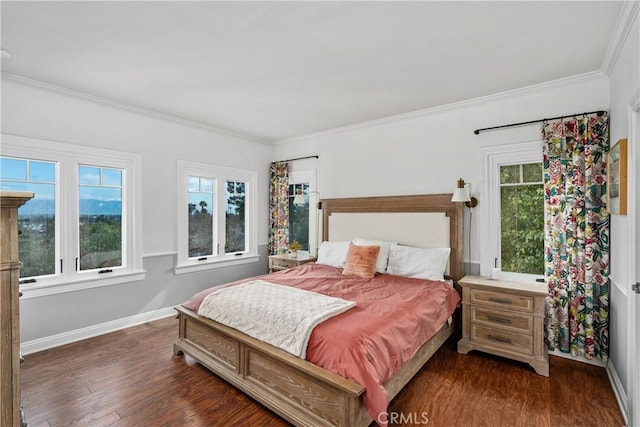 bedroom featuring baseboards, dark wood finished floors, and ornamental molding