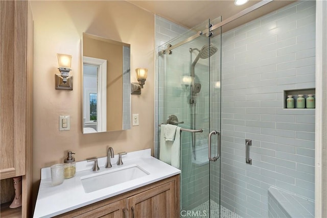 full bath featuring a stall shower and vanity