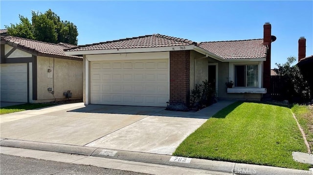 view of front of property with a garage and a front yard