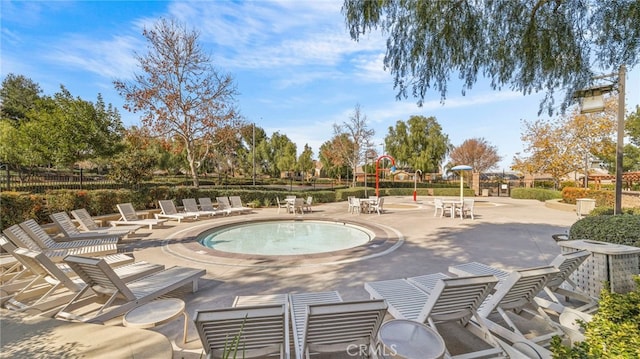 view of swimming pool with a patio