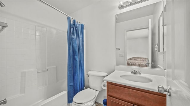 full bathroom with vanity, toilet, and shower / bath combo with shower curtain