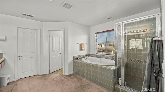 bathroom with shower with separate bathtub