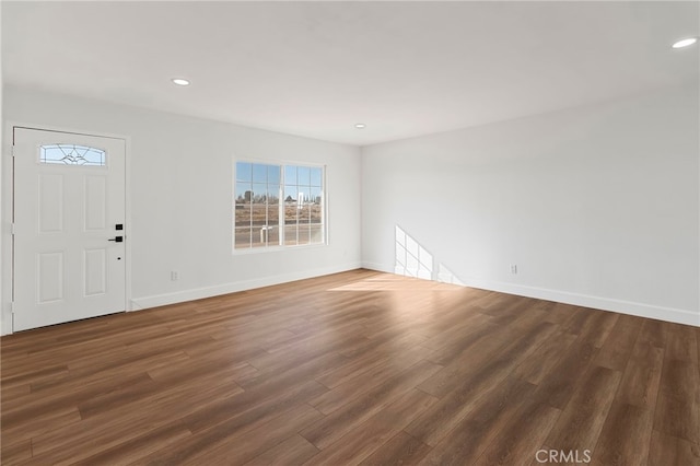 entryway with dark hardwood / wood-style flooring