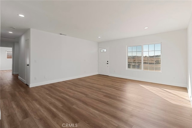 empty room with dark wood-type flooring