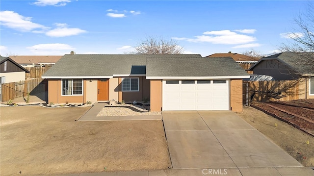 ranch-style home featuring a garage