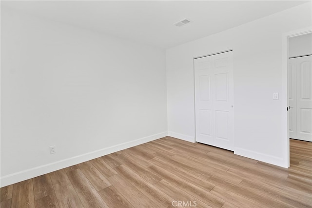 unfurnished bedroom with light hardwood / wood-style flooring