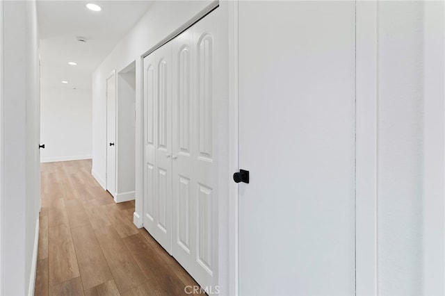 hallway with light wood-type flooring