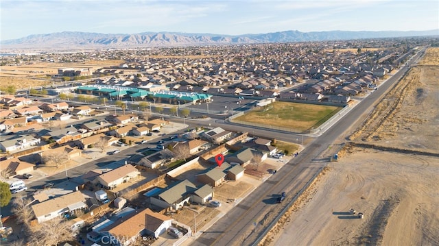 birds eye view of property featuring a mountain view