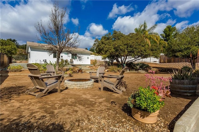 view of yard with a fire pit