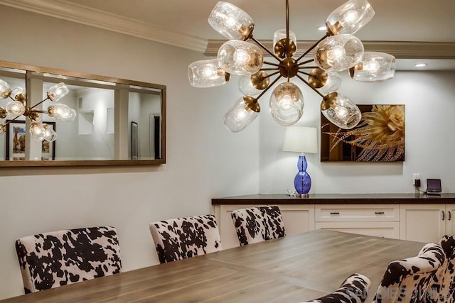 dining space featuring crown molding