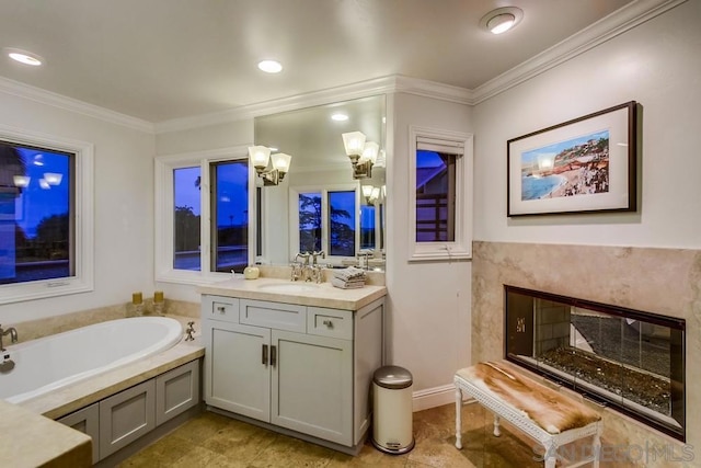 bathroom with crown molding, vanity, a bath, and a high end fireplace