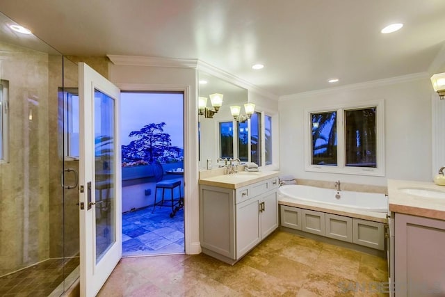 bathroom featuring ornamental molding, shower with separate bathtub, a chandelier, and vanity