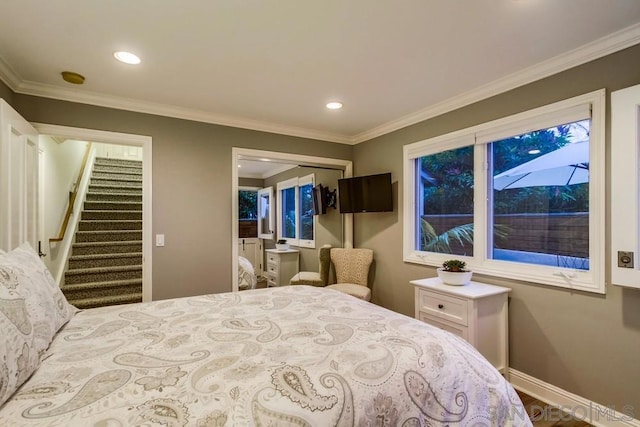 bedroom with ornamental molding and a closet