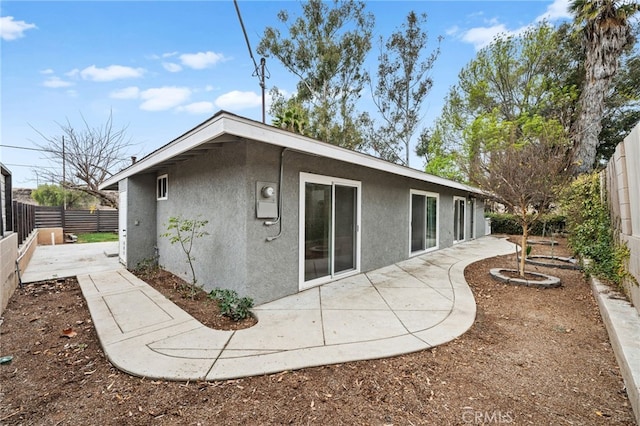 rear view of property featuring a patio area