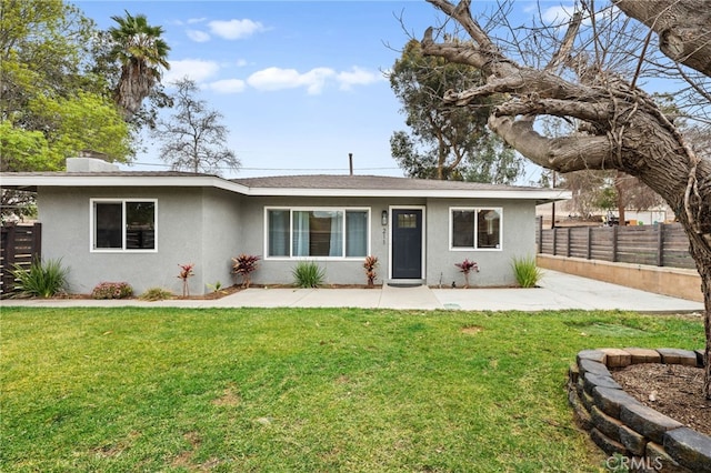 ranch-style house featuring a front lawn