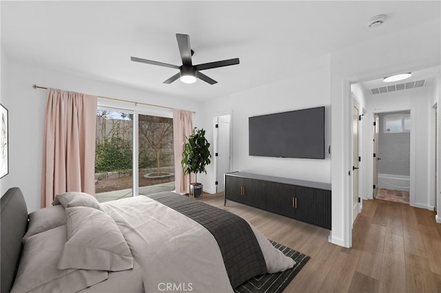 bedroom with ceiling fan, access to exterior, and light hardwood / wood-style floors