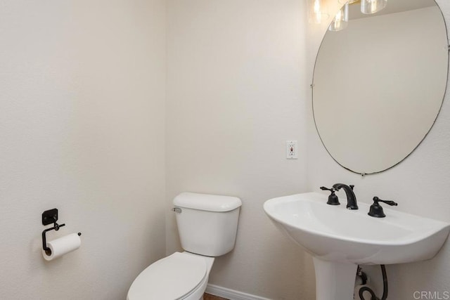 bathroom featuring sink and toilet