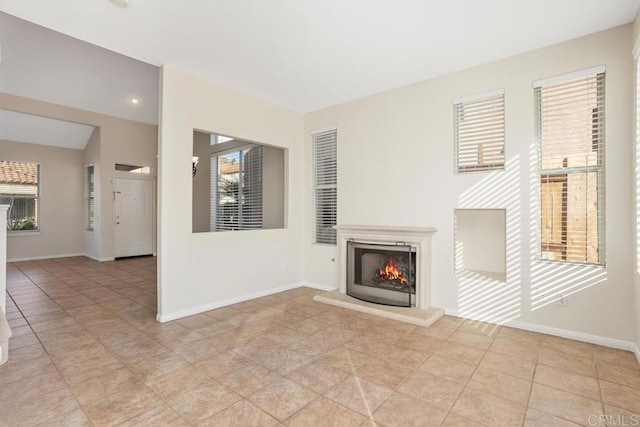 unfurnished living room featuring light tile patterned floors