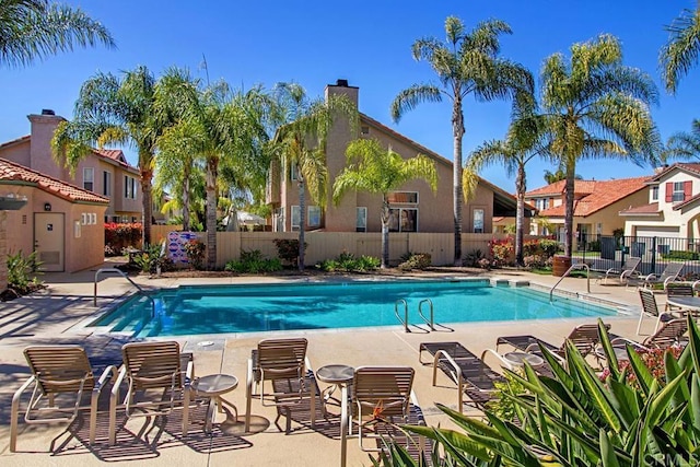 view of swimming pool with a patio area