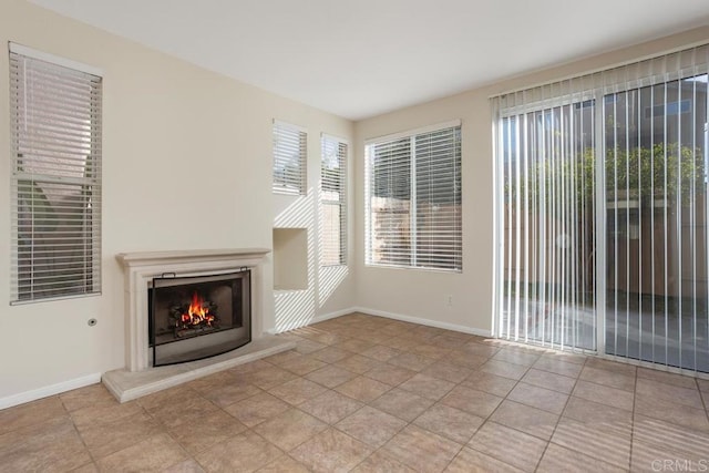 unfurnished living room featuring light tile patterned flooring