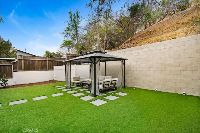 view of yard featuring a gazebo and outdoor lounge area