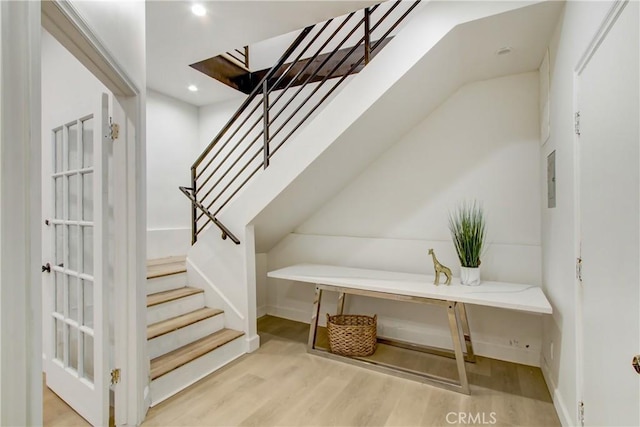 stairs with wood-type flooring