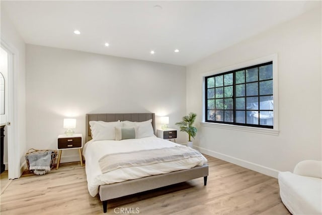 bedroom with light hardwood / wood-style floors