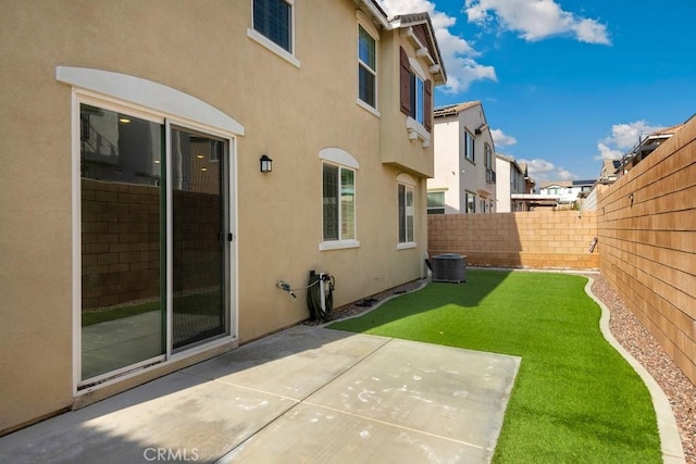 view of yard with a patio and central AC