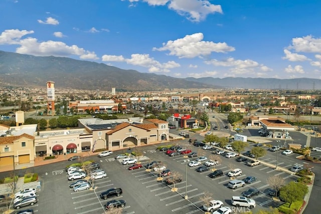 birds eye view of property featuring a mountain view