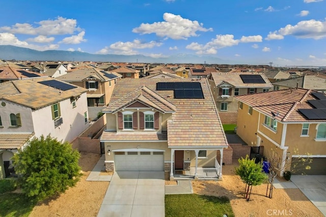 view of front of home featuring a garage and solar panels