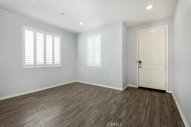 empty room featuring dark hardwood / wood-style floors