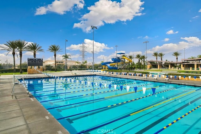 view of swimming pool featuring a water slide