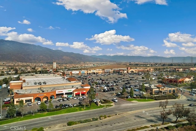 birds eye view of property with a mountain view