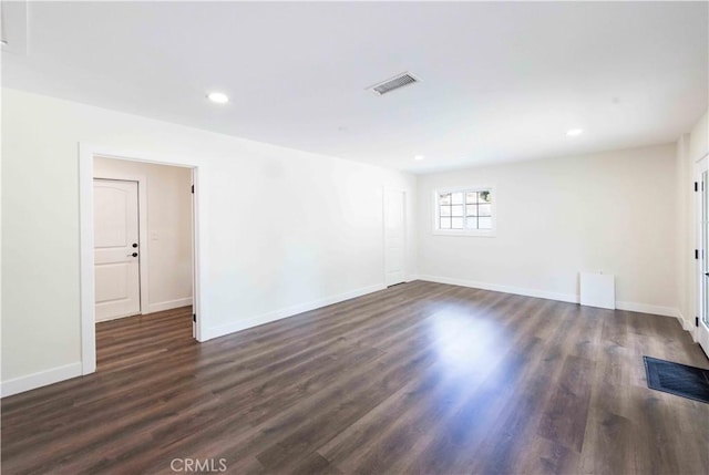 empty room featuring dark wood-type flooring