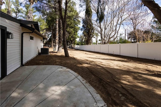 view of yard with a patio area and central air condition unit