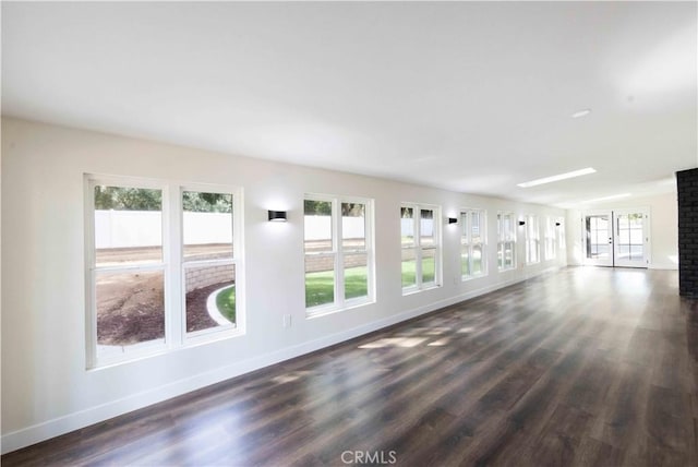 empty room featuring dark hardwood / wood-style flooring