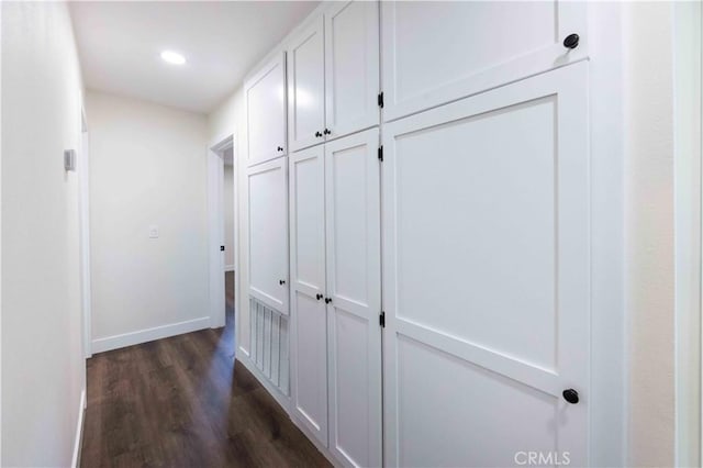 hallway featuring dark wood-type flooring