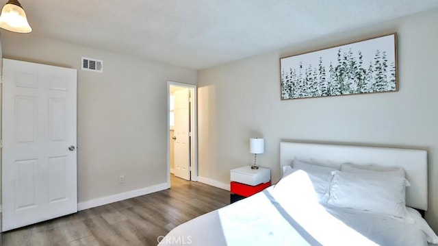 bedroom featuring hardwood / wood-style floors